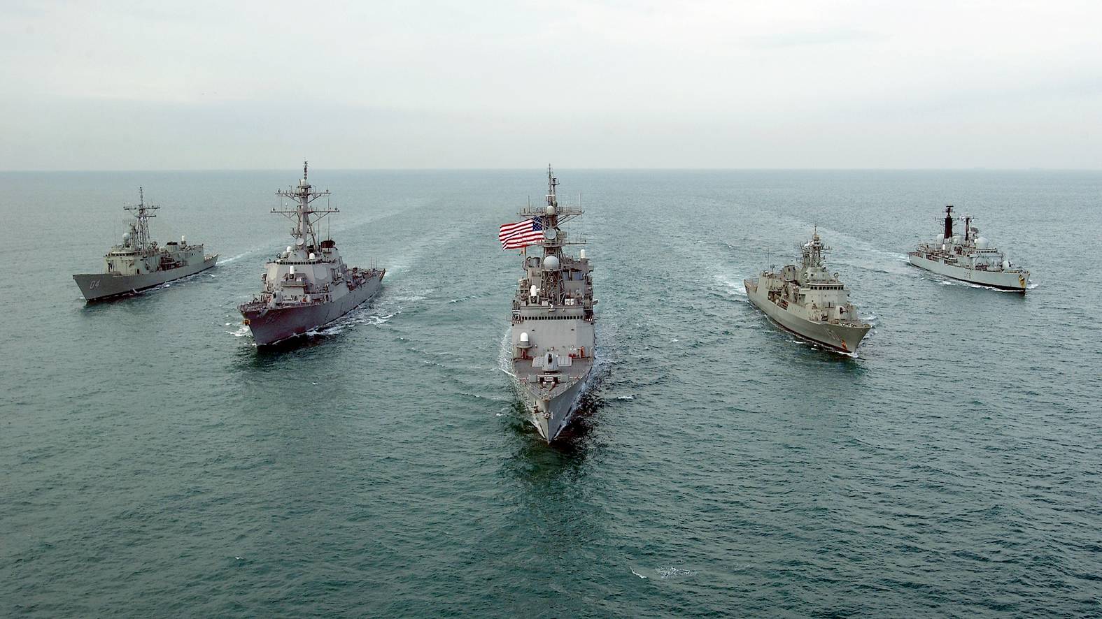 021216-N-5319A-003 - Central Command AOR - Her Majesty's Australian Ship HMAS DARWIN (F 04), USS PAUL HAMILTON (DDG 60), USS FLETCHER (DD 992), HMAS ANZAC (F 150), and Her Majesty's Ship HMS CARDIFF (D 108) conducting (MIO) Maritime Interdiction Operations in the Arabian Gulf take time to cruise in formation for a photography exercise. The fore mentioned ships are in the Central Command AOR in support of Operation Enduring Freedom and in accordance with Security Council resolutions. Official U.S. Navy Photograph by: Photographers Mate First Class PH1 Brien Aho; Fleet Combat Camera, AtlanticFor Official Use Only (FOUO) NOT CLEARED FOR PUBLIC RELEASE by CDR. Jeff Alderson, COMUSNAVCENT/ 5TH Fleet PAO.