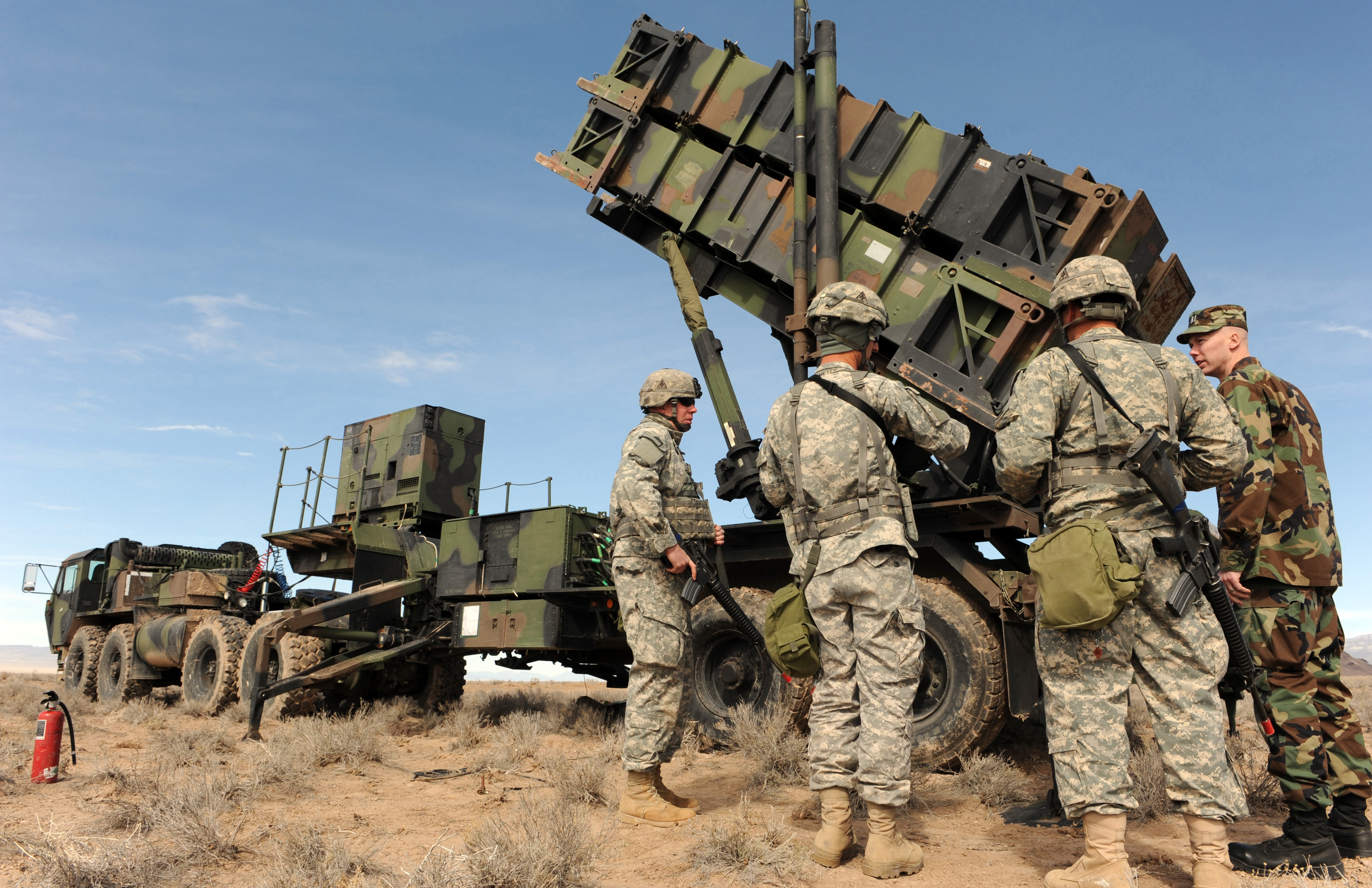 NELLIS AIR FORCE BASE, Nev. -- Soldiers from the 108th Air Defense Artillery Regiment from Fort Bragg, N.C., show Chaplain (Capt.) Steven Barfield, Red Flag Air Expeditionary Wing chaplain from Mountain Home Air Force Base, Idaho, the Patriot missile Feb. 27 as they participate in Red Flag 09-3. With the capability to identify enemies in the air and protect allies both on the ground and in the sky the Patriot unit is one of many assets to coalition forces. The Patriot is a long-range, all-altitude, all-weather defense system used to counter tactical ballistic missiles, cruise missiles and advanced aircraft. Red Flag is a realistic combat training exercise involving the air forces of the United States and its allies. The exercise is conducted on the 15,000-square-mile Nevada Test and Training Range north of Las Vegas. (U.S. Air Force photo/ Airman 1st Class Debbie Lockhart)
