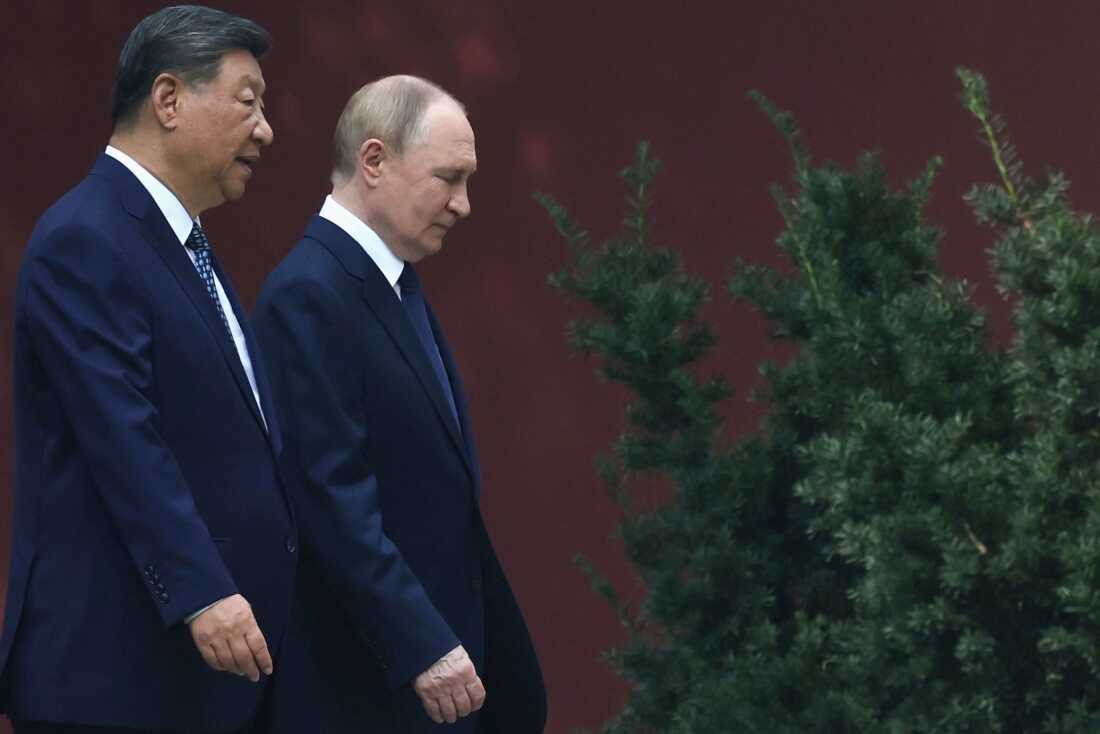 FILE - Russian President Vladimir Putin, right, speaks with Chinese President Xi Jinping during a walk at the Zhongnanhai leadership compound in Beijing, China, Sept. 2, 2025. (Alexander Kazakov, Sputnik, Kremlin Pool Photo via AP, File)