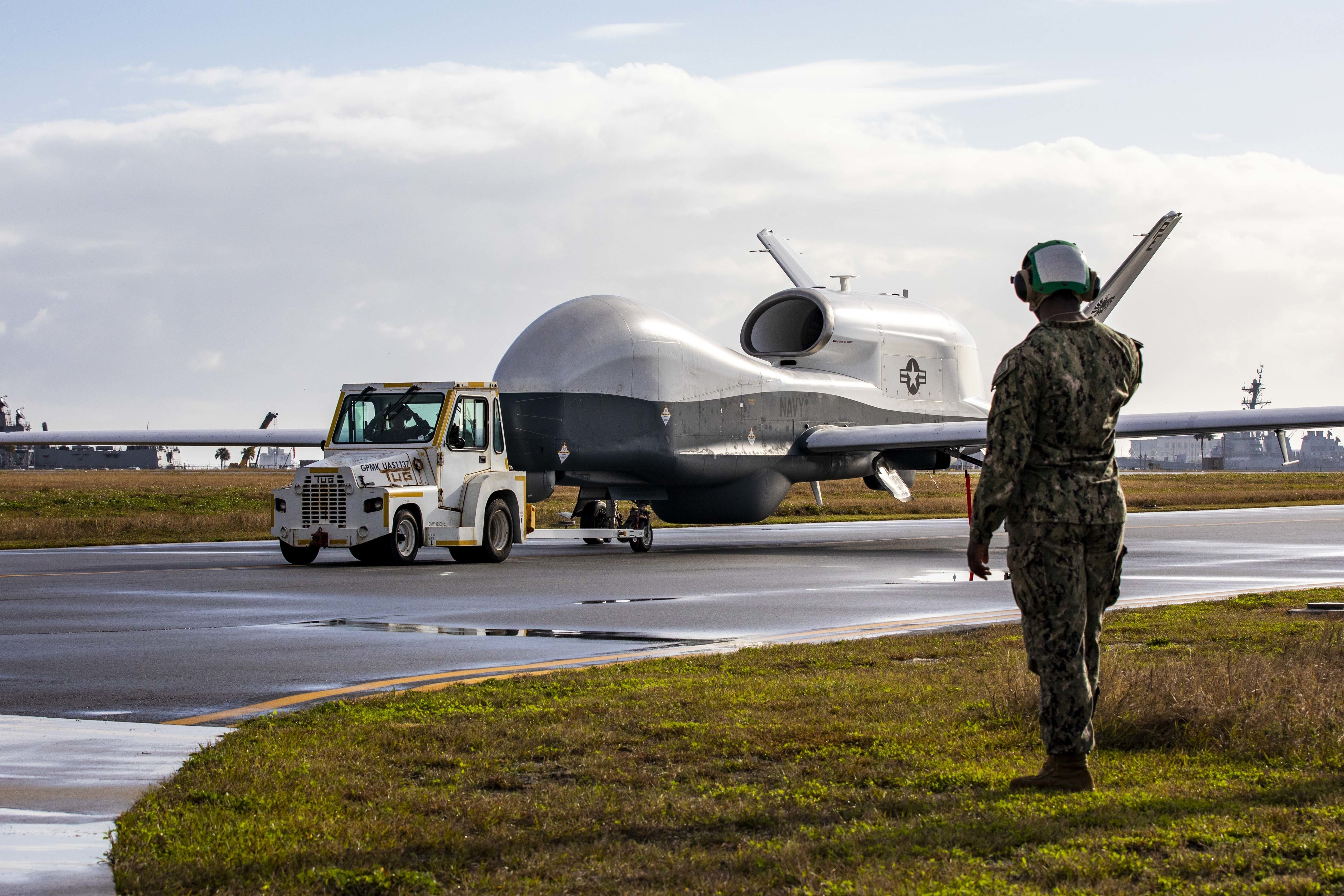 211216-N-QI061-1187NAVAL STATION MAYPORT, Fla. (December 16, 2021) An MQ-4C Triton Unmanned Aircraft System (UAS), assigned to Unmanned Patrol Squadron 19 (VUP-19), taxis across the flight line at Naval Station Mayport, Florida, Dec. 16, 2021. VUP-19, the Navy’s first Triton squadron, will continue to maintain and operate the aircraft off the East Coast to further develop the concept of operations and refine tactics, techniques, and procedures. (U.S. Navy photo by Mass Communication Specialist 2nd Class Nathan T. Beard/ Released)