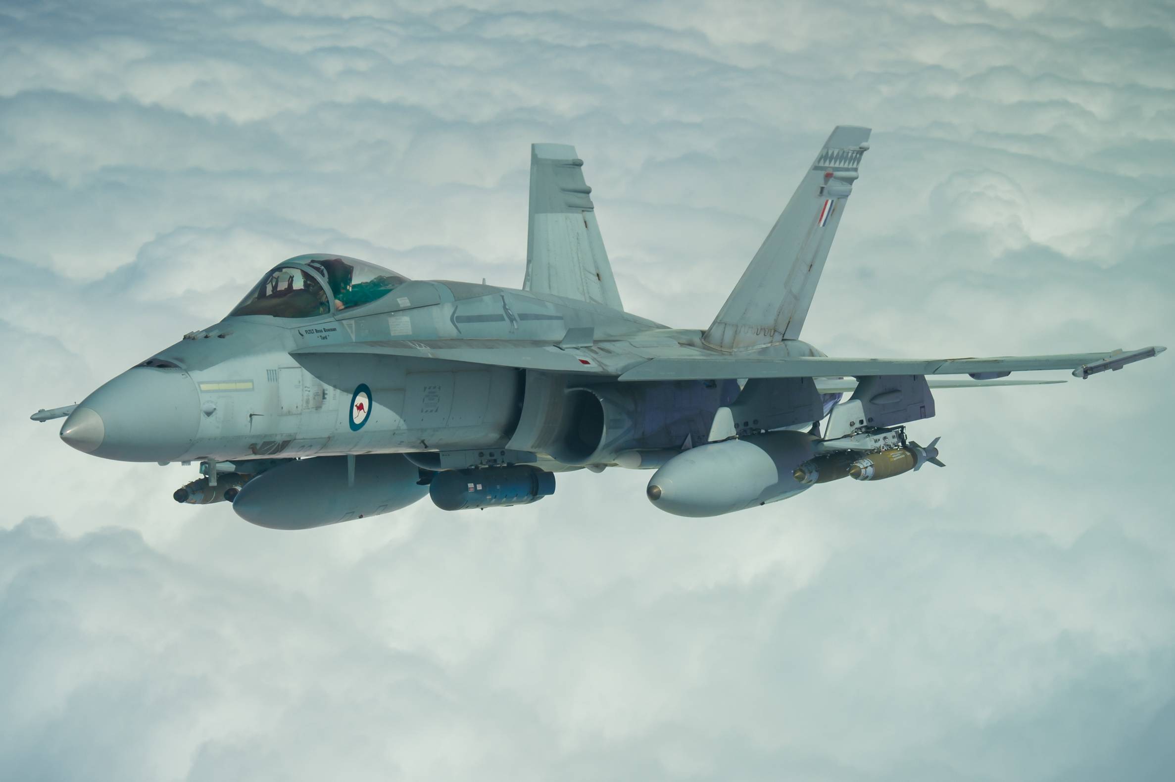 A Royal Australian Air Force F/A-18A Hornet receives fuel from a U.S. Air Force KC-10 Extender while flying a mission in support of Operation Okra over Iraq, March 22, 2017. The RAAF is supporting Combined Joint Task Force-Operation Inherent Resolve through Operation Okra. Since operations commenced in 2014, the F/A-18A Hornets and F/A-18F Super Hornets have flown more than 12,000 hours during more than 2,000 sorties and delivered more than 1,600 munitions. (U.S. Air Force photo/Senior Airman Tyler Woodward)
